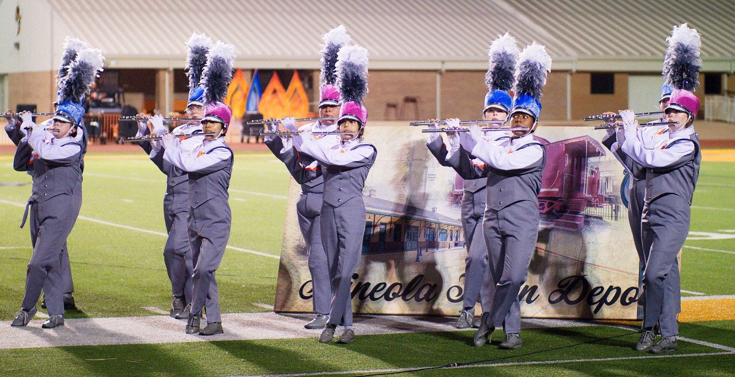 The Mineola High School band performs an exhibition after hosting their contest Monday evening. They compete at the regional marching contest Tuesday in Mt. Pleasant. [See more marching magic.]